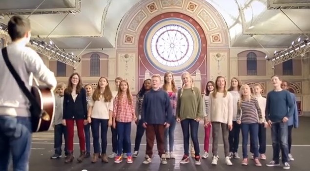 It's a youth choir singing an inspirational song. Run. RUN!