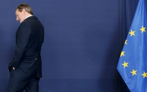 Britain's PM Cameron arrives to pose for a family photo during an EU leaders summit in Brussels