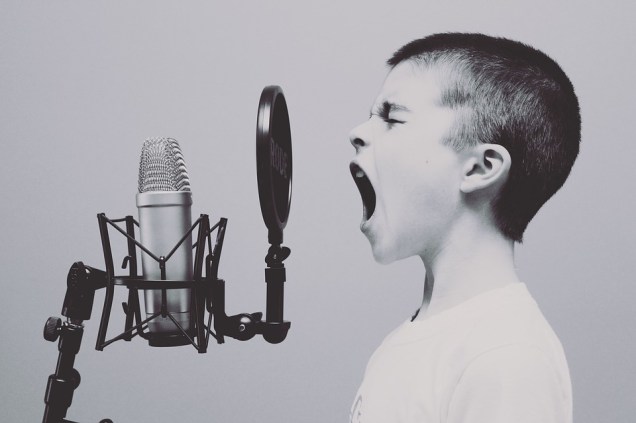 boy-shouting-microphone